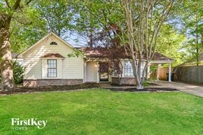 Memphis house for rent - a white house with a yard and trees