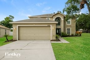 Riverview house for rent - A house with a garage and a driveway in front of it.