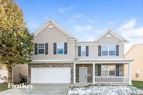 Indianapolis house for rent - a beige house with a white garage door