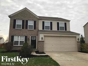 Morrow house for rent - a house with a driveway and a garage door