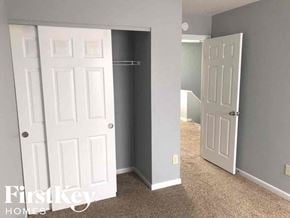 Morrow house for rent - a bedroom with two doors and a closet and a door to a closet
