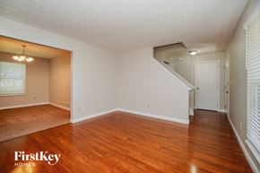 Westerville house for rent - the living room and dining room of an empty house with wood floors