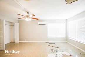 Hollywood house for rent - a living room with a ceiling fan and a large hole in the floor