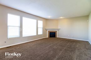 Morrow house for rent - the living room of an empty house with a fireplace