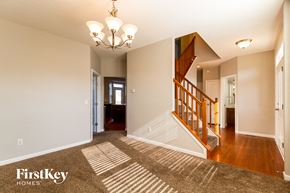 Morrow house for rent - the entryway of a house with a staircase and a carpeted floor