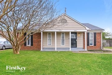 Memphis house for rent - a small brick house with a tree in front of it