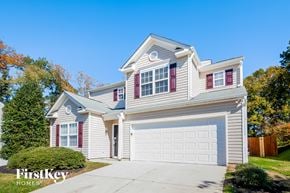 Charlotte house for rent - a white house with a white garage door