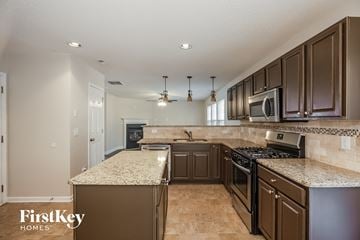 Charlotte house for rent - an updated kitchen with granite counter tops and stainless steel appliances