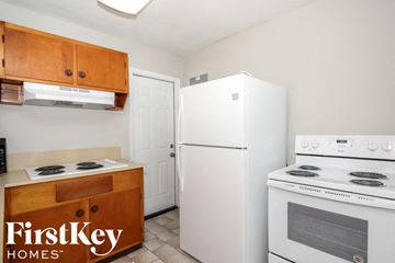 Hollywood house for rent - a kitchen with white appliances and a refrigerator