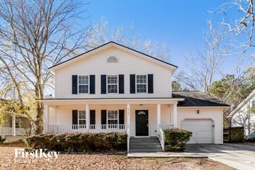 North Charleston house for rent - a white house with black shutters and a black front door