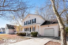 North Charleston house for rent - a white house with black shutters and a garage door
