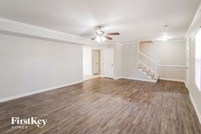 North Charleston house for rent - a living room with wood flooring and a ceiling fan