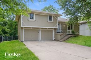 Parkville house for rent - A two-story house with a garage is for sale.