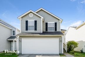 Indianapolis house for rent - a gray house with a white garage door