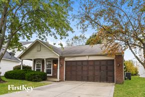 Zionsville house for rent - A house with a brown garage door is for sale.