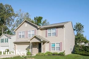 Indianapolis house for rent - A two-story house with a garage is for sale.