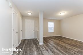 Mccordsville house for rent - A room with wooden flooring and white walls.