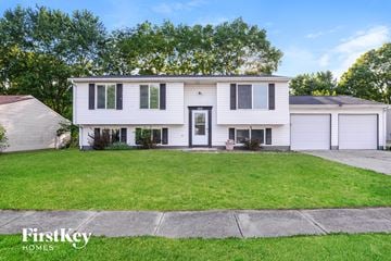 Indianapolis house for rent - a white house with a lawn in front of it