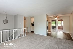 Indianapolis house for rent - the living room and dining room with the kitchen in the background