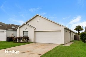 Jacksonville house for rent - A two-car garage is attached to a house.
