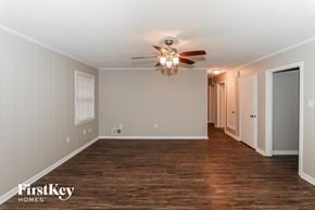 Bartlett house for rent - the living room of an empty house with a ceiling fan