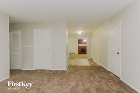 Indianapolis house for rent - A room with a carpeted floor and white walls.