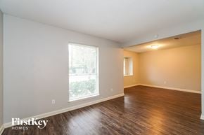 Houston house for rent - A room with wooden floors and a window letting in light.