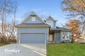 Parkville house for rent - a blue house with a gray garage door