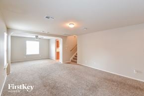 San Antonio house for rent - a living room with carpet and a staircase in a house