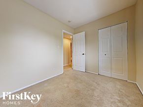 Hanover Park house for rent - a bedroom with two closets and a door to a hallway