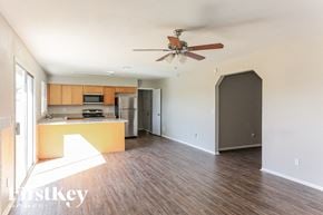 Peoria house for rent - A kitchen with a refrigerator, microwave, and oven is shown in this image.