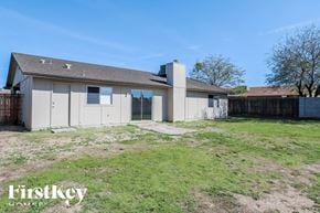 Peoria house for rent - A house with a fence and a grassy yard is for sale.
