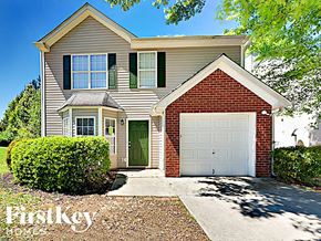 Lithonia house for rent - a suburban house with a white garage door