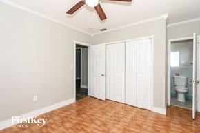 Pembroke Pines house for rent - a bedroom with two closets and a toilet and a ceiling fan