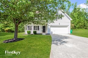 Charlotte house for rent - a white house with a tree in front of it