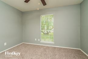 Fort Worth house for rent - the bedroom with carpet and a window