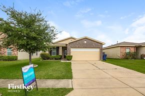 Baytown house for rent - A house with a sign that says "Firstkey Homes" in front of it.