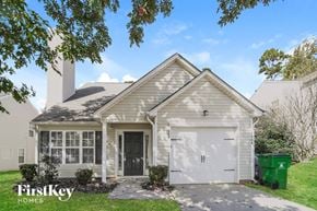 Charlotte house for rent - a white house with a white garage door