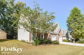 Braselton house for rent - A house with a white garage door is for sale by FirstKey Homes.