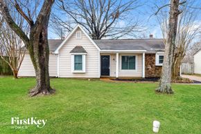 Memphis house for rent - a white house with a lawn and two trees