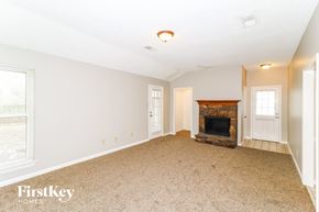 Memphis house for rent - a living room with a fireplace and a door