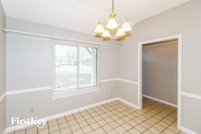 Memphis house for rent - a dining room with a window and a chandelier