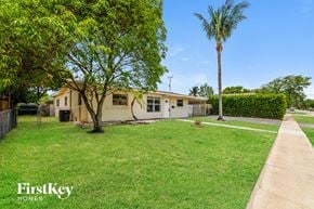 Hollywood house for rent - a house with a yard and a palm tree