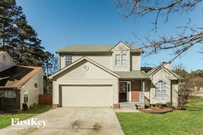 Riverdale house for rent - a suburban home with a white garage door