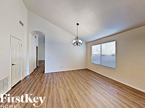 Mesa house for rent - a spacious living room with hardwood flooring and a large window