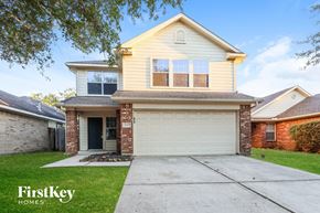 Magnolia house for rent - A two-story house with a garage is for sale.