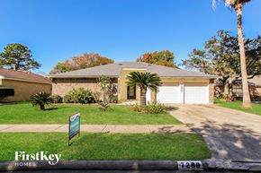 Houston house for rent - A house with a sign that says FirstKey Homes in front of it.