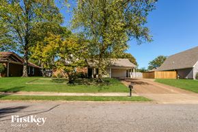 Memphis house for rent - A residential area with houses and trees.