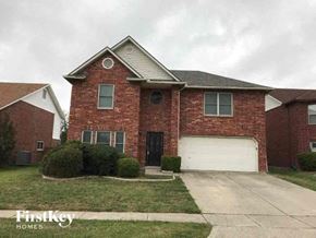 Arlington house for rent - A brick house with a garage door is for sale.