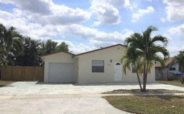 North Lauderdale house for rent - a house with a palm tree in front of it
